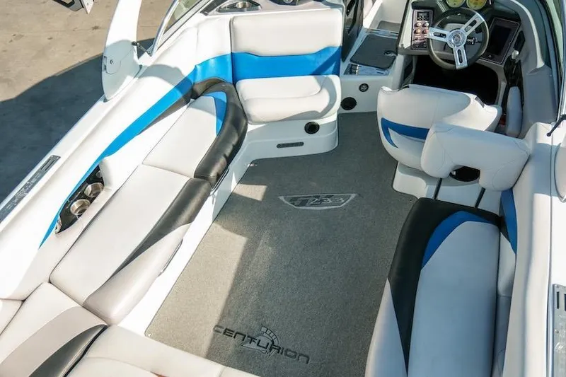 Slide: The Image of Interior of 2014 Centurion Enzo SV233 boat with white and blue seating. - 15