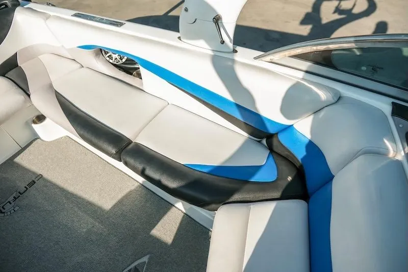 Slide: The Image of 2014 Centurion Enzo SV233 boat interior with blue and black seating. - 18