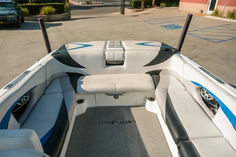 Slide: The Image of 2014 Centurion Enzo SV233 boat interior with cushioned seating and sleek design. - 19