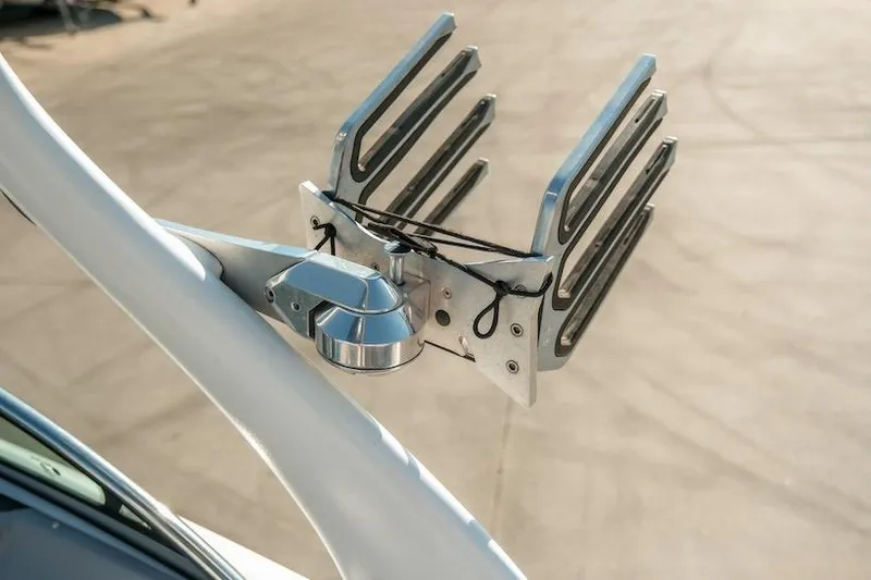 Slide: The Image of Wakeboard rack on 2014 Centurion Enzo SV233 boat, mounted on a white tower. - 25