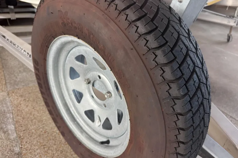 Slide: The Image of Red 2017 Formula 240 Bowrider boat with metallic "240" emblem detail. - 11