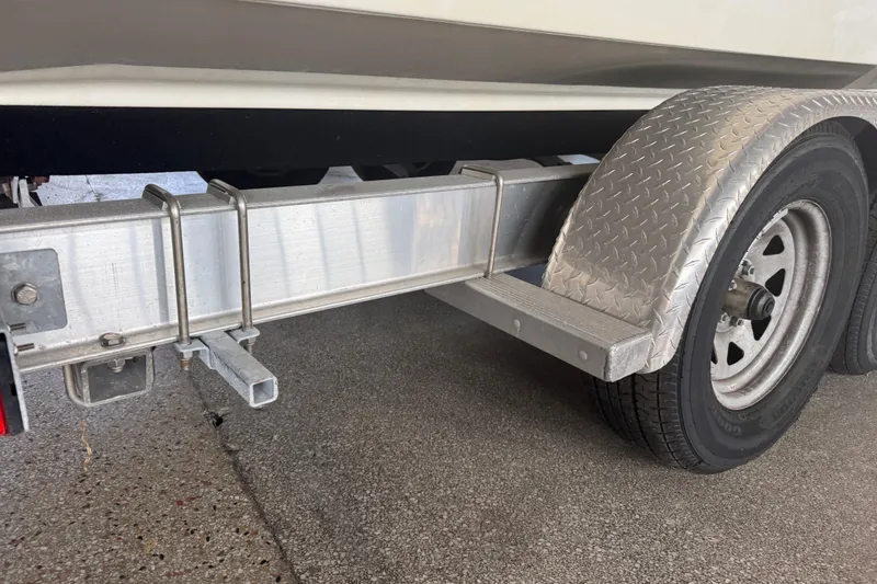 Slide: The Image of 2017 Formula 240 Bowrider boat interior with white cushioned seating and cup holders. - 16