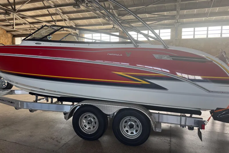 Slide: The Image of 2017 Formula 240 Bowrider interior storage compartment, white and spacious design. - 19