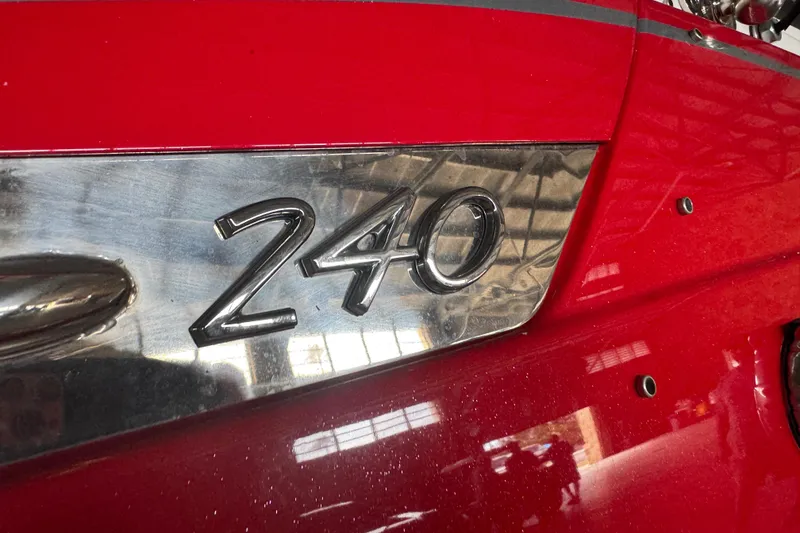 Slide: The Image of 2017 Formula 240 Bowrider boat on trailer in indoor storage facility. - 2