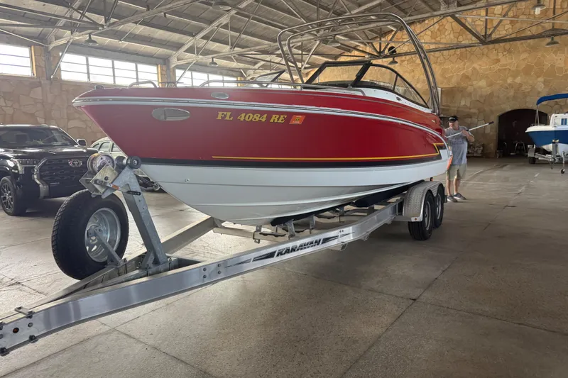 Slide: The Image of Steering wheel and dashboard of 2017 Formula 240 Bowrider boat, featuring gauges and controls. - 22