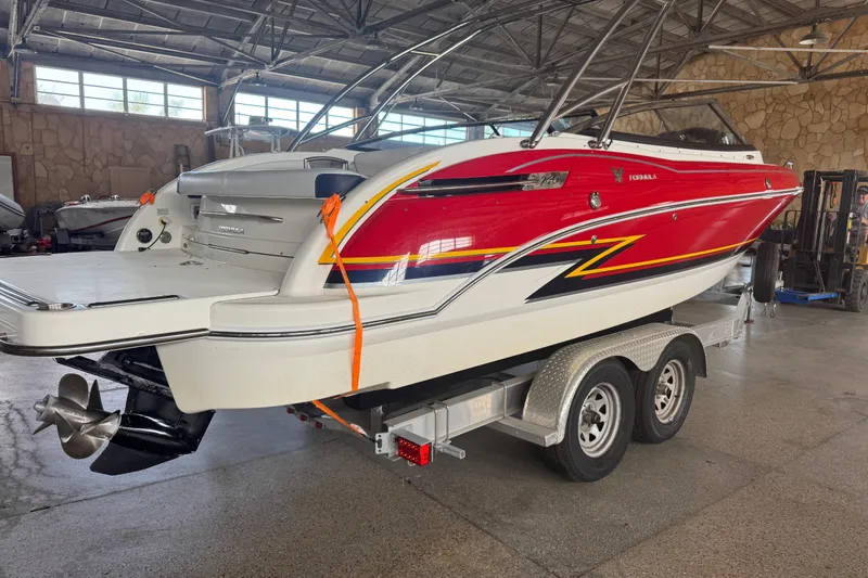 Slide: The Image of 2017 Formula 240 Bowrider interior with white seating and red accents. - 29