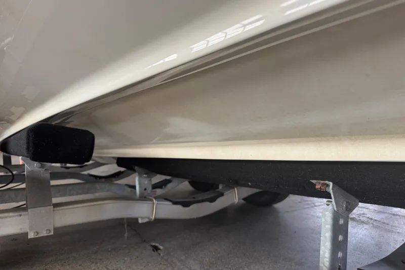 Slide: The Image of 2017 Formula 240 Bowrider interior seating with cup holder and storage area. - 31