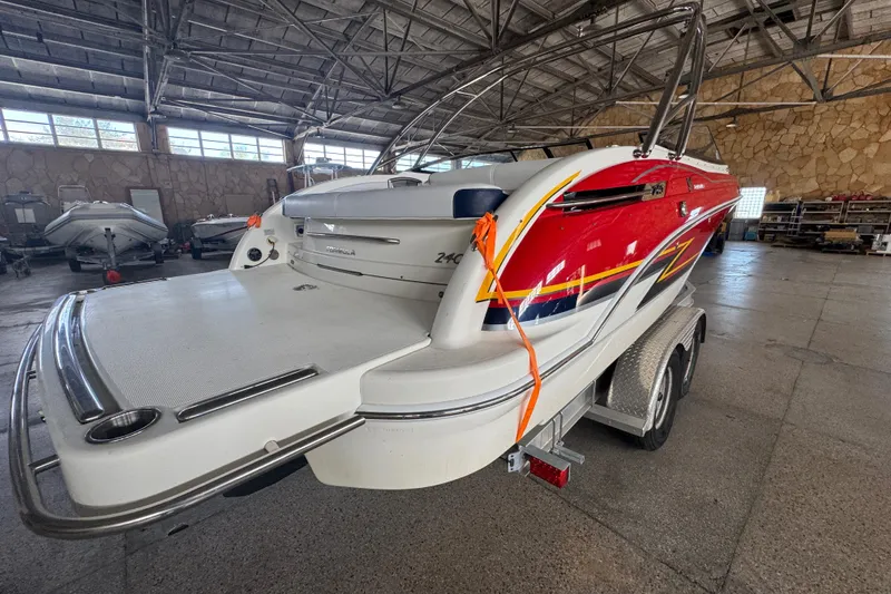 Slide: The Image of 2017 Formula 240 Bowrider interior storage compartment with open hatch and seating. - 33
