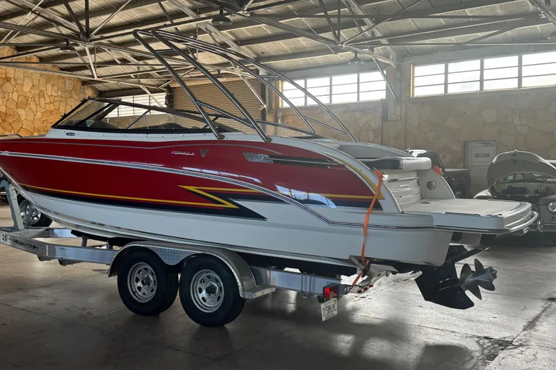 Slide: The Image of 2017 Formula 240 Bowrider interior with open storage compartment, black seating. - 34