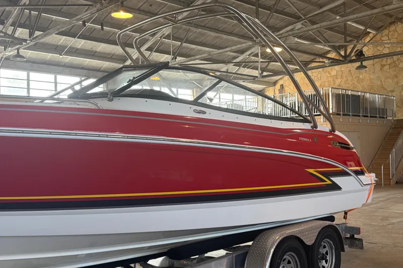 Slide: The Image of Interior storage compartment of 2017 Formula 240 Bowrider boat with fire extinguisher. - 36