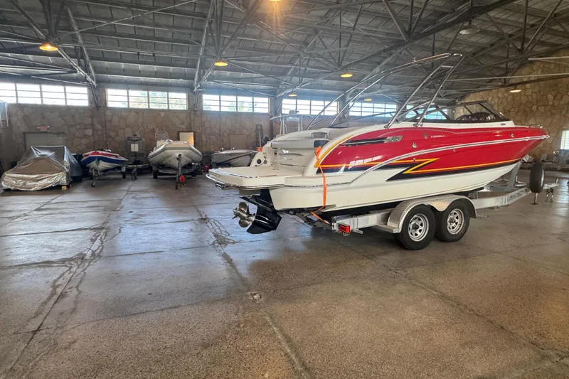 Slide: The Image of 2017 Formula 240 Bowrider interior with cushioned seating and cup holders. - 40