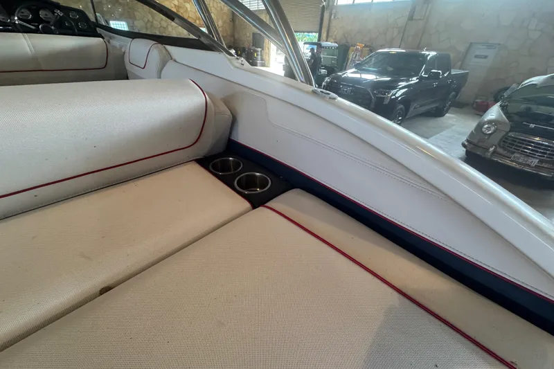 Slide: The Image of 2017 Formula 240 Bowrider interior storage compartment with cup holders. - 43