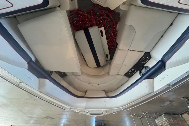 Slide: The Image of 2017 Formula 240 Bowrider boat on trailer in spacious indoor storage facility. - 53