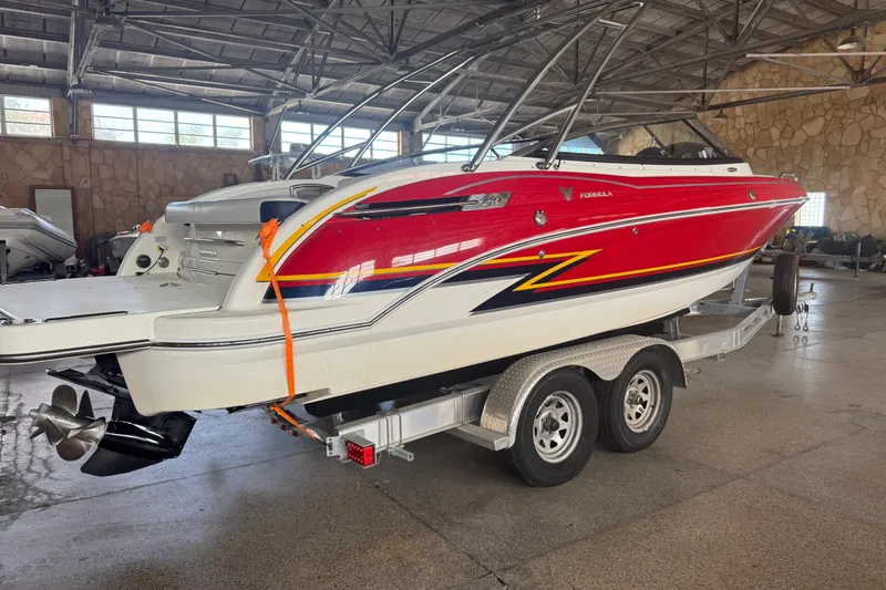 Slide: The Image of 2017 Formula 240 Bowrider boat on trailer near Caribbean Jack's restaurant. - 6