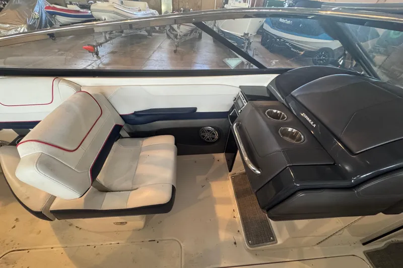 Slide: The Image of Close-up of a trailer tire with tread pattern, supporting a 2017 Formula 240 Bowrider. - 67