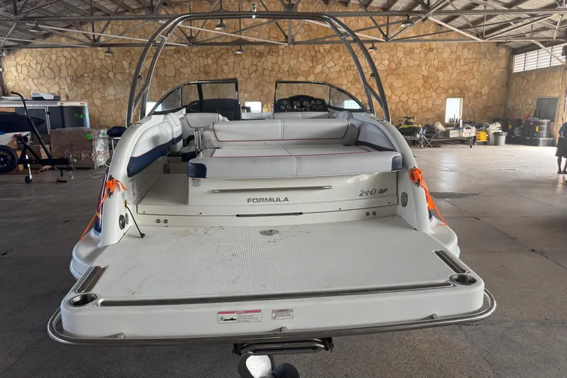 Slide: The Image of 2017 Formula 240 Bowrider boat on trailer in indoor storage facility. - 7