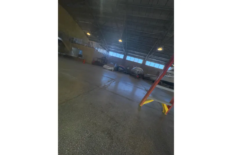 Slide: The Image of 2017 Formula 240 Bowrider boat on trailer in indoor storage facility. - 75