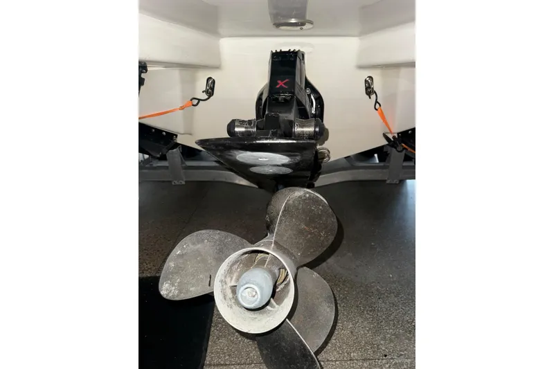 Slide: The Image of 2017 Formula 240 Bowrider boat propeller and stern view in garage setting. - 88