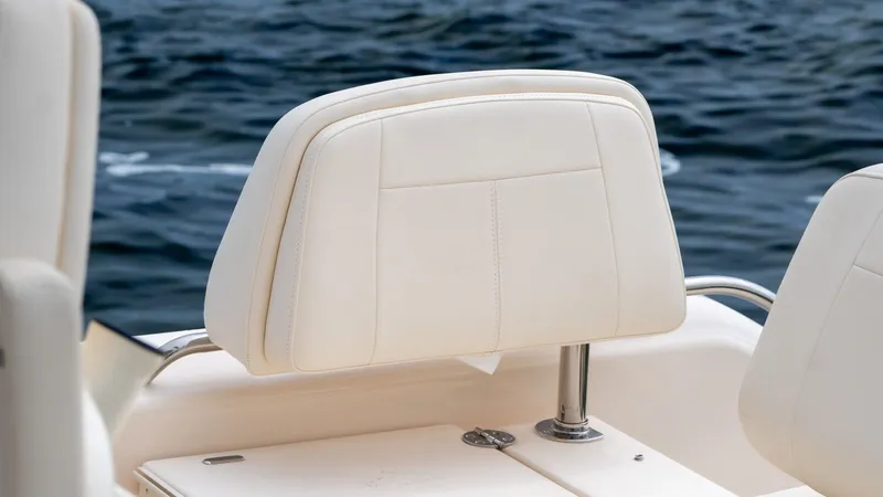 Slide: The Image of Grady-White 281 Coastal Explorer 2026 seat by the water. - 16