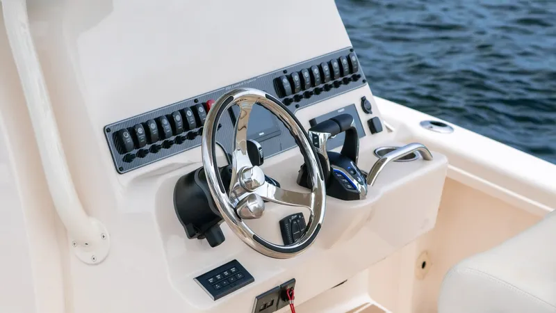 Slide: The Image of Steering console of the 2026 Grady-White 281 Coastal Explorer. - 18