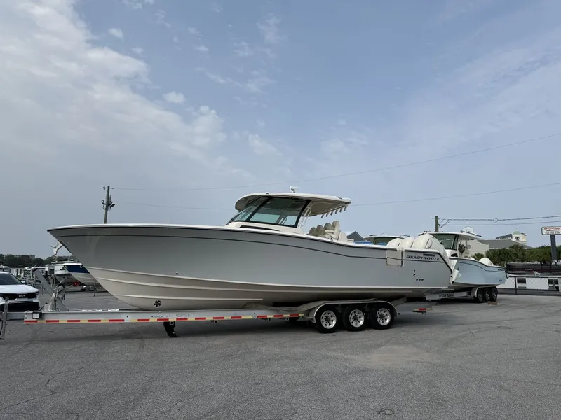Slide: The Image of A 2027 Grady-White Canyon 386 boat on a trailer in a parking lot. - 4