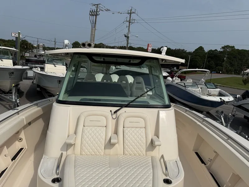 Slide: The Image of 2027 Grady-White Canyon 386 with luxurious seating and spacious deck. - 19