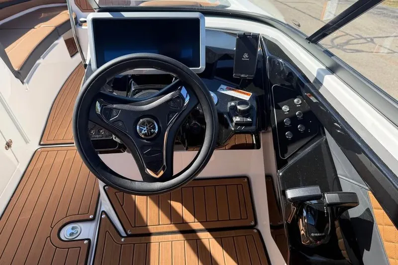 Slide: The Image of 2026 Yamaha Boats 252SD dashboard with steering wheel and modern controls. - 10