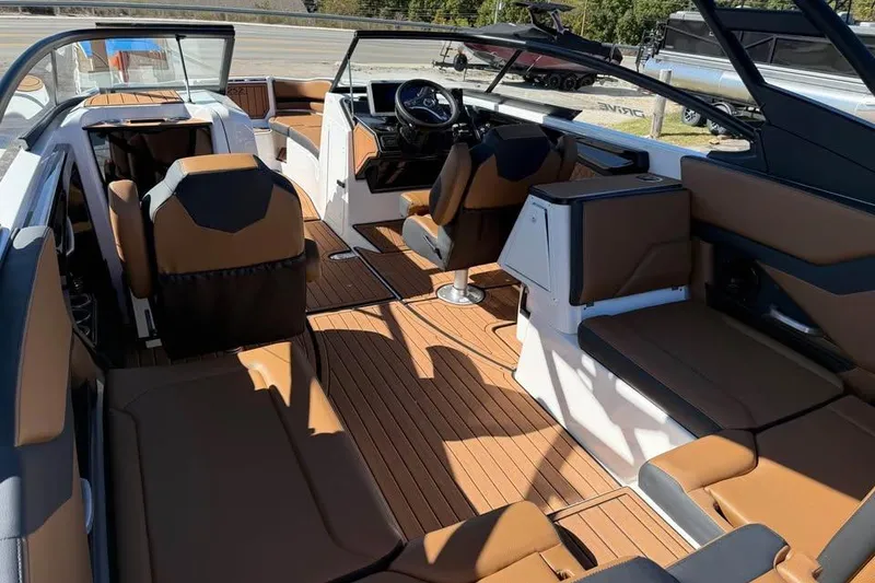 Slide: The Image of 2026 Yamaha Boats 252SD interior with luxurious seating and modern dashboard design. - 7