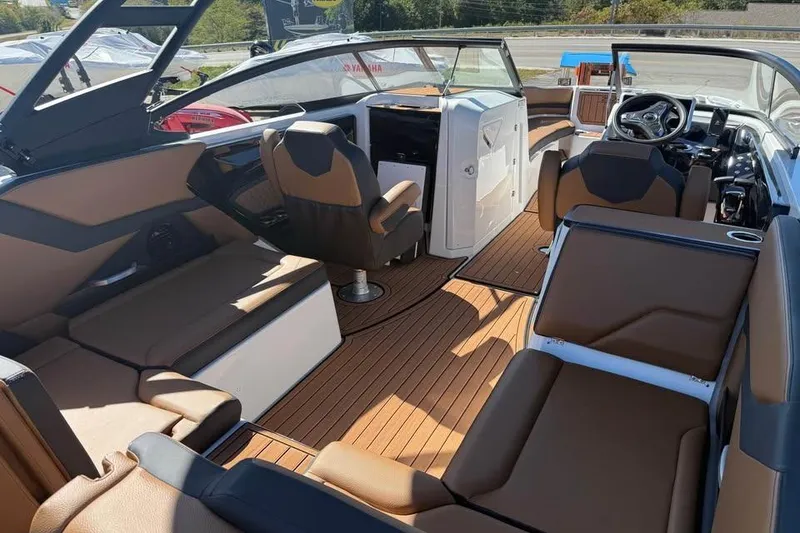Slide: The Image of 2026 Yamaha Boats 252SD interior with luxurious seating and modern dashboard design. - 8