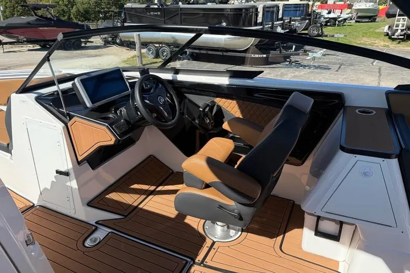 Slide: The Image of 2026 Yamaha Boats 252SD interior with modern dashboard and luxurious seating. - 9