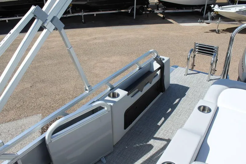 Slide: The Image of 2025 Avalon Venture 85 Versatile Rear Bench, 23 FT boat interior with seating and cup holders. - 13
