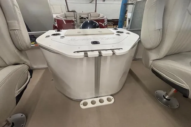 Slide: The Image of Interior of 2009 South Bay 722 FCR boat with seating and storage compartment. - 16