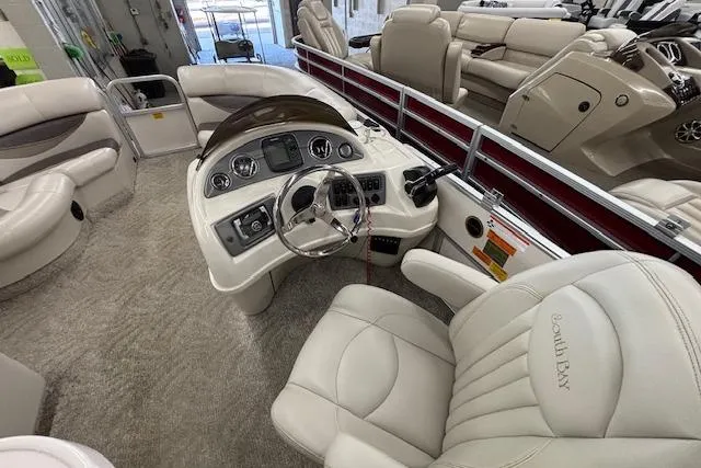 Slide: The Image of Luxurious 2009 South Bay 722 FCR boat interior with plush seating and modern dashboard. - 9