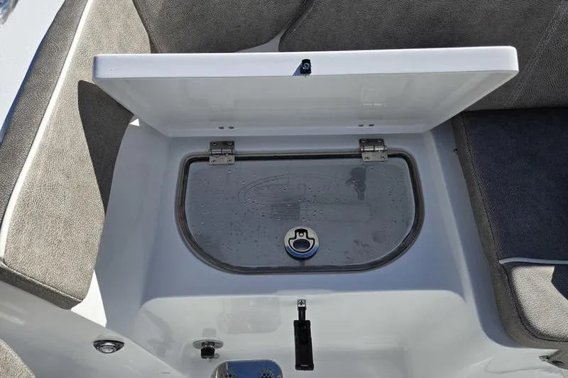 Slide: The Image of Open storage compartment on 2026 Sea Hunt Ultra 285 SE boat. - 23