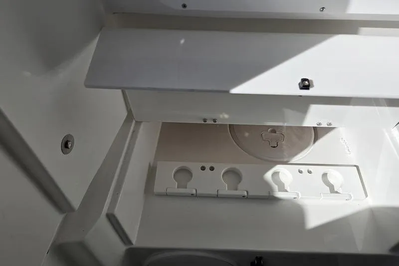 Slide: The Image of Interior compartment of 2026 Sea Hunt Ultra 285 SE boat, featuring storage and utility spaces. - 25
