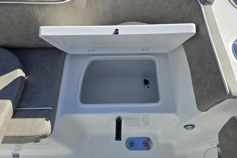 Slide: The Image of Open storage compartment on 2026 Sea Hunt Ultra 285 SE boat interior. - 27