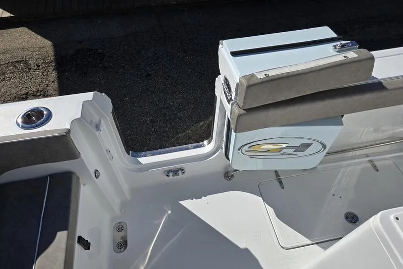 Slide: The Image of 2026 Sea Hunt Ultra 285 SE boat interior with seating and storage compartment. - 4