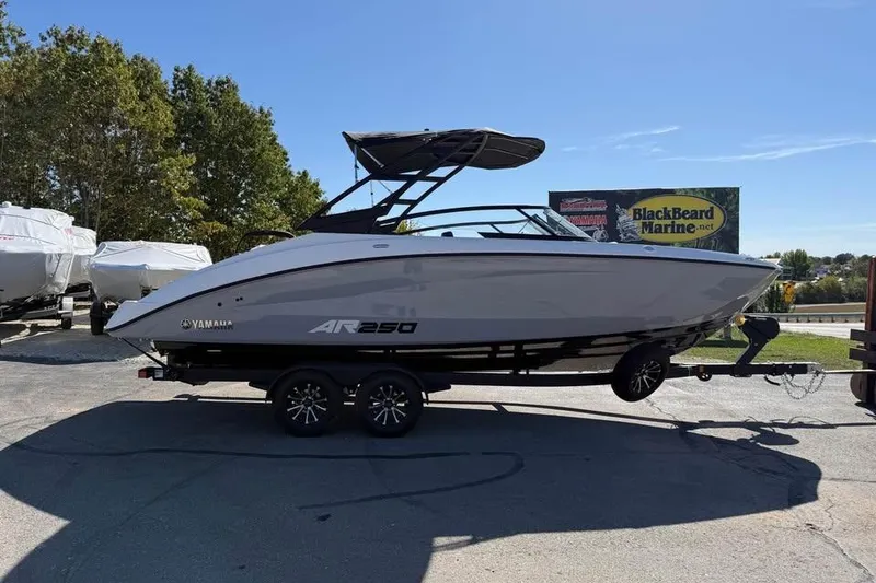 The Image of 2026 Yamaha AR250 boat on trailer at BlackBeard Marine dealership. - 0