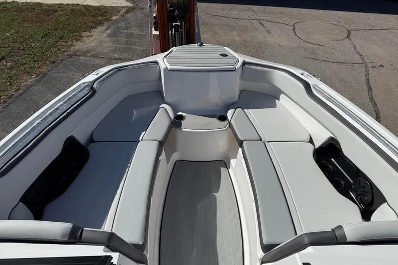 Slide: The Image of 2026 Yamaha Boats AR250 interior with spacious seating and modern design. - 11