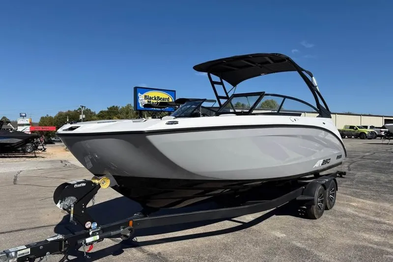 Slide: The Image of 2026 Yamaha AR250 boat on trailer under clear blue sky. - 3