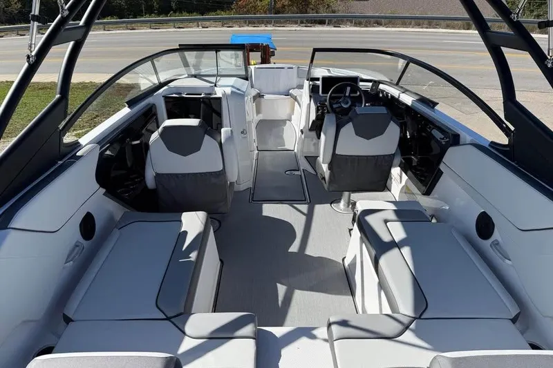 Slide: The Image of 2026 Yamaha Boats AR250 interior with modern seating and sleek design. - 7
