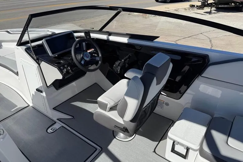Slide: The Image of 2026 Yamaha AR250 boat interior with modern helm and seating. - 8