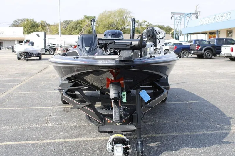 Slide: The Image of 2026 Skeeter ZXE21 boat on trailer in parking lot, front view. - 10