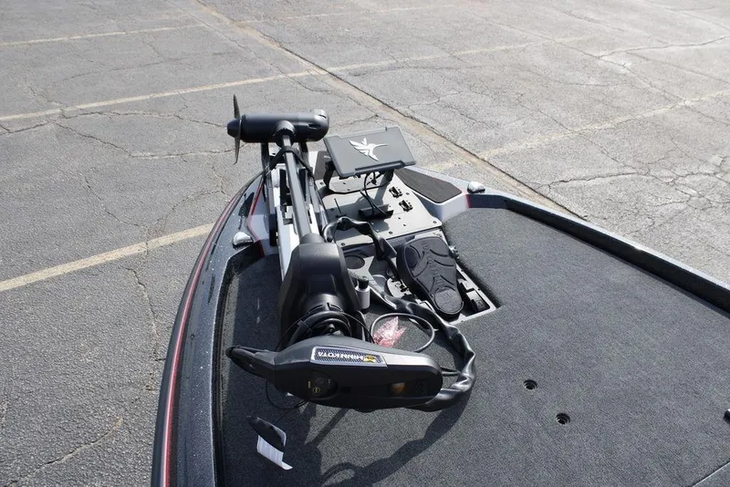 Slide: The Image of 2026 Skeeter ZXE21 boat with advanced trolling motor on asphalt surface. - 15