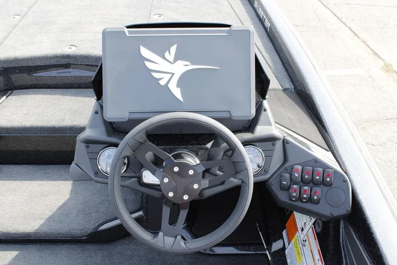 Slide: The Image of 2026 Skeeter ZXE21 boat dashboard with steering wheel and control panel. - 21