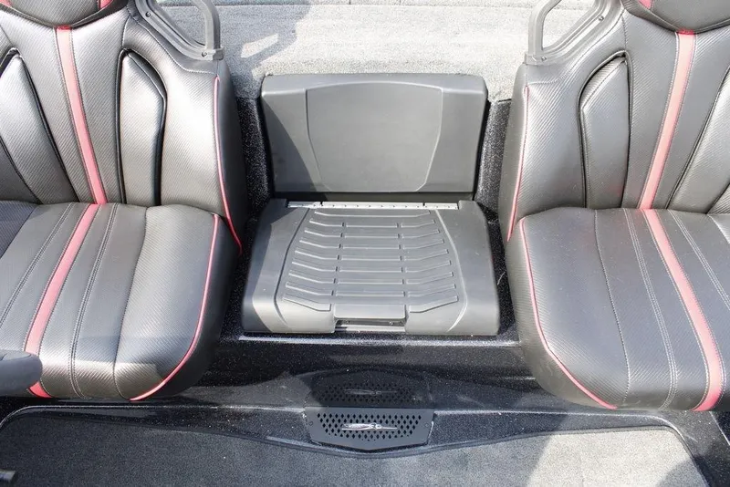 Slide: The Image of 2026 Skeeter ZXE21 boat seats with black and red upholstery, featuring a central storage compartment. - 22