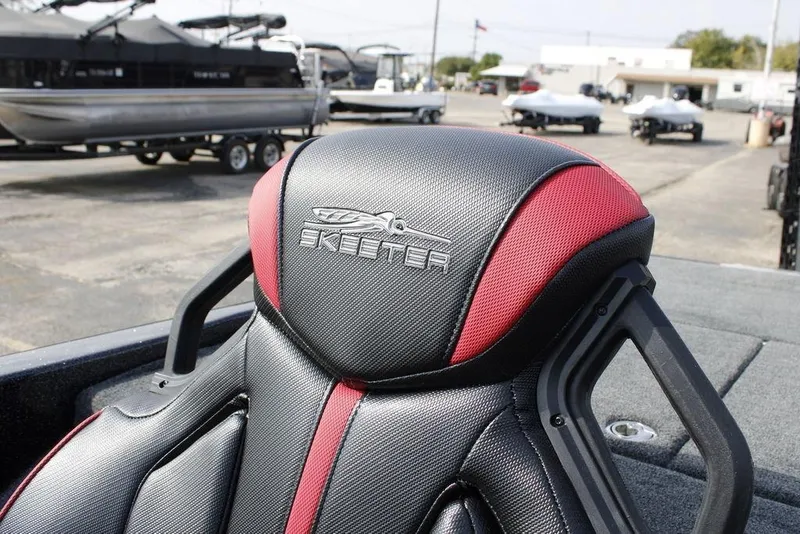 Slide: The Image of Skeeter ZXE21 2026 boat seat with logo, featuring black and red design. - 29
