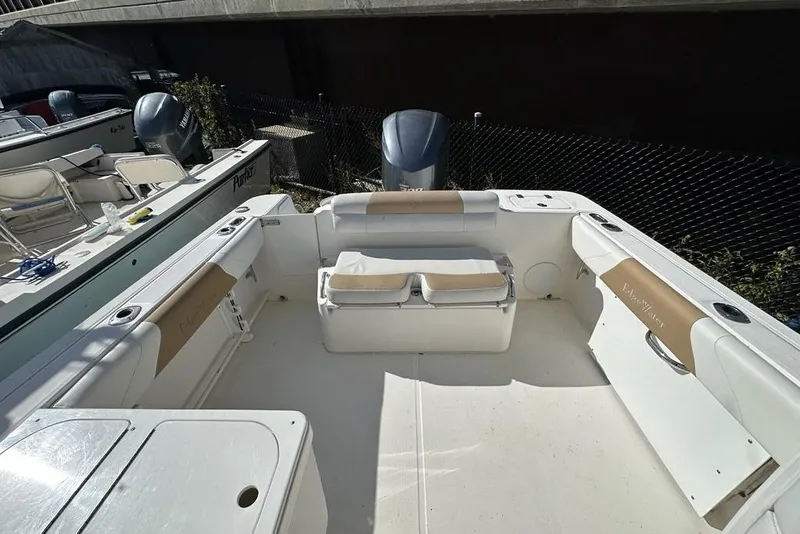 Slide: The Image of 2014 Edgewater 245CX Crossover boat interior with seating and storage compartments. - 20
