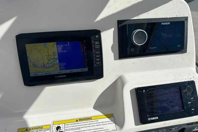 Slide: The Image of Dashboard of 2014 Edgewater 245CX Crossover with Garmin, Fusion, and Yamaha displays. - 6