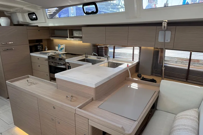 Slide: The Image of Modern kitchen interior of 2026 Beneteau Oceanis 52 yacht with sleek cabinetry and appliances. - 10